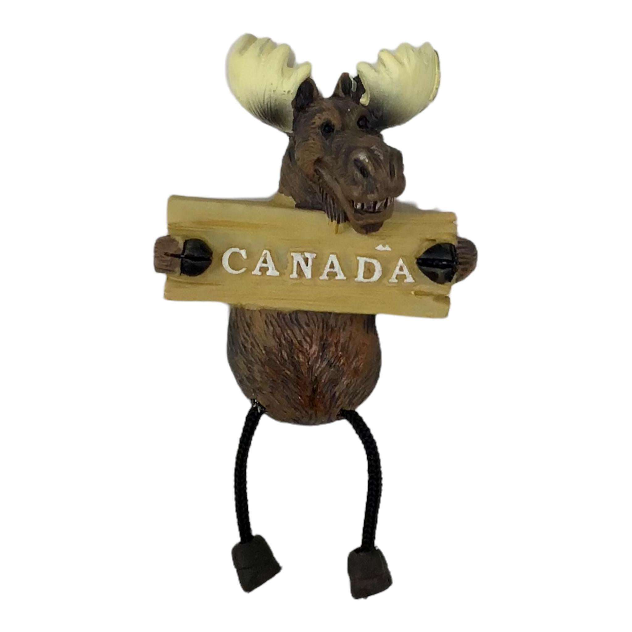Canada moose magnet holding Canada board sign